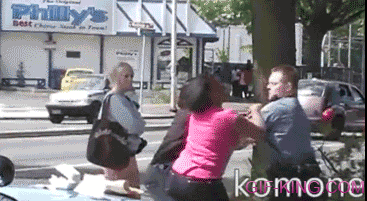Cop punches woman