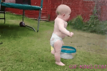 Baby Running Away From Garden Sprinkler