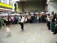 Kid gets kicked by break dancer