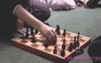 Hamster Steals Chess Piece Off of a Chess Board