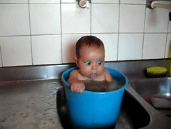 Baby sitting inside bucket