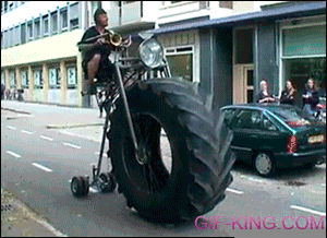 Man Rides Bike Unicycle With Huge Front Tire