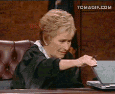 Judge Judy Slowly Opening Up Laptop