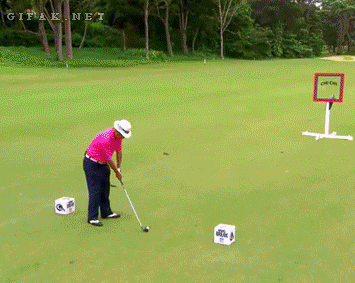 Golfer attempts a trick shot